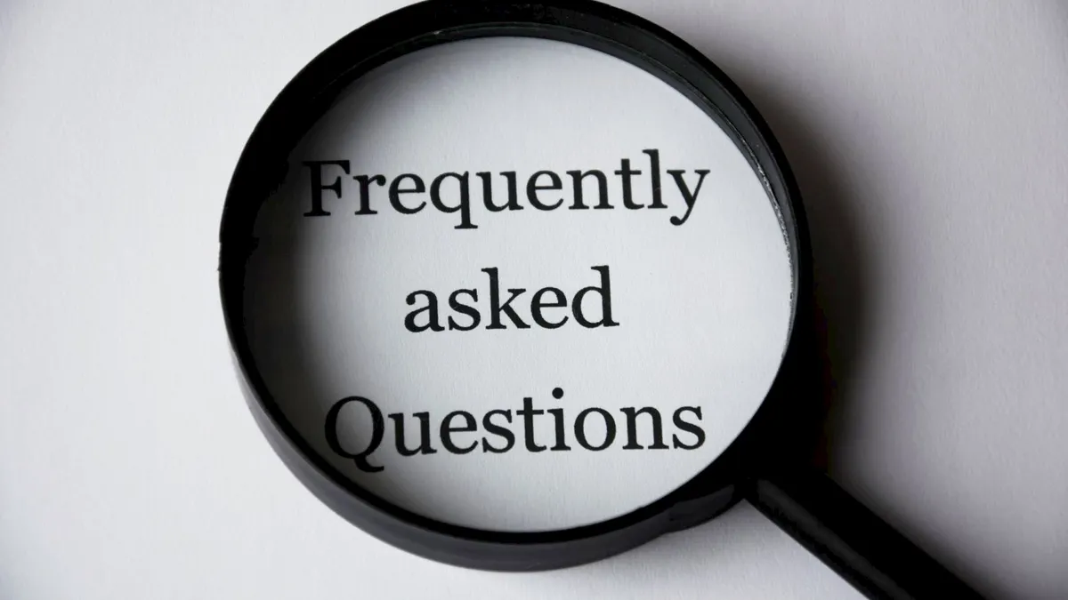 Magnifying glass over the words Frequently asked Questions